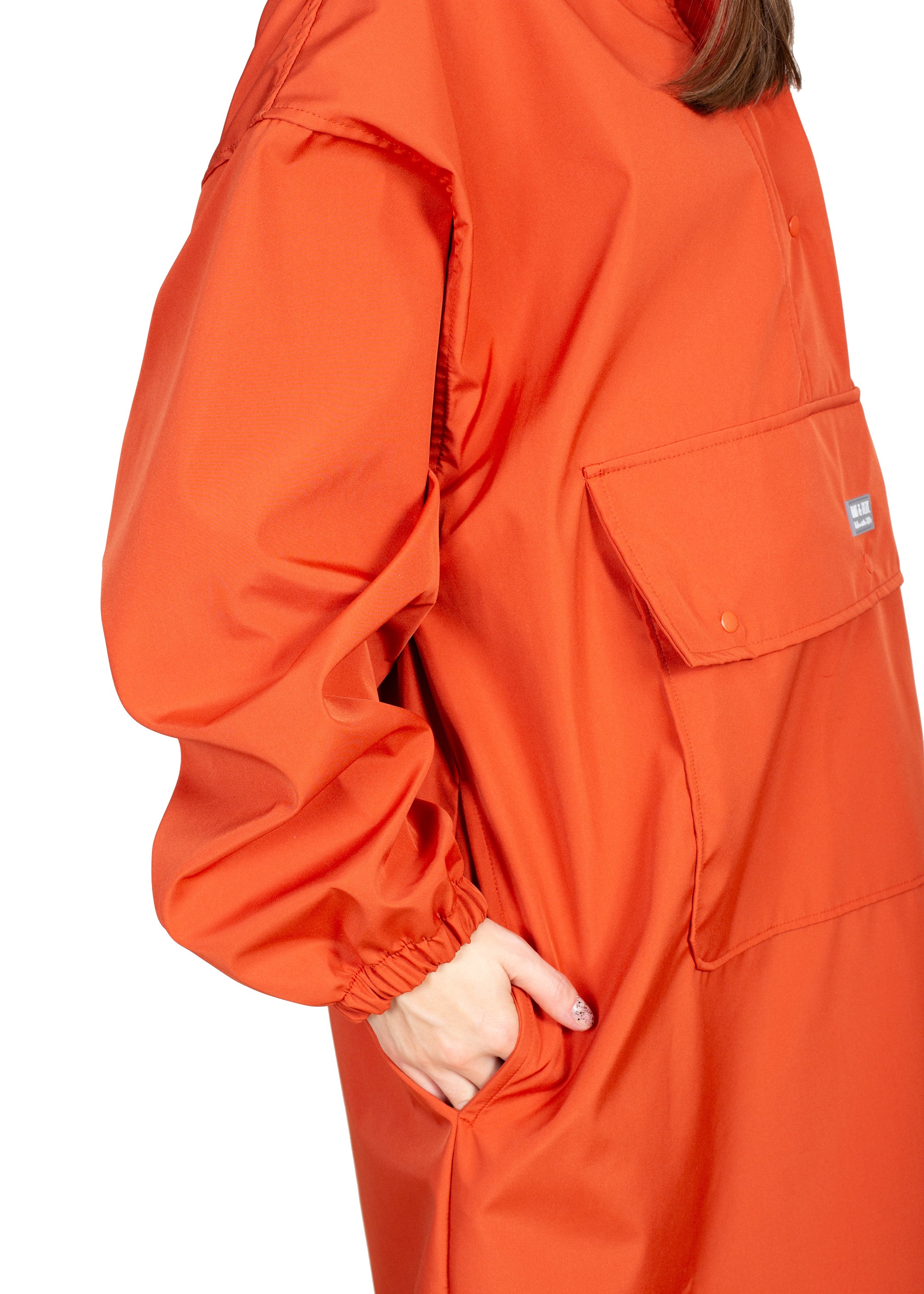 Wau-Poncho Orange, mit vielen verschiedenen Taschen