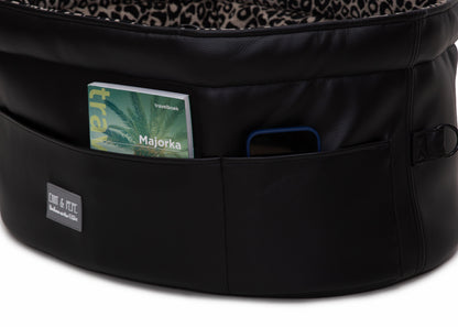 Außentaschen des Wau-Snuggle Reisebett in oval mit robustem schwarzen Kunstleder an der Außenseite 