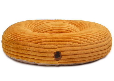 orthopaedisches Hundebett Wau-Bed Kuschelcord Big für Hunde auf weißem Hintergrund in der Farbe Mustard in Oval von EMMY & PEPE